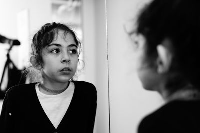 Portrait of a beautiful young woman looking away