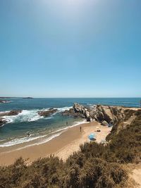 Scenic view of beach against clear sky