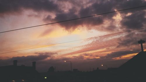 Low angle view of cloudy sky at sunset