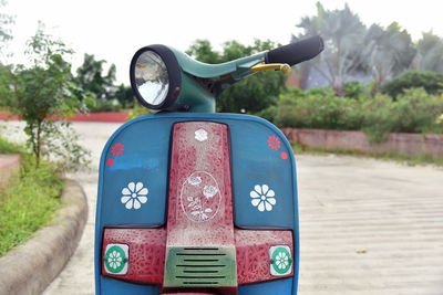 Close-up of vintage car on road