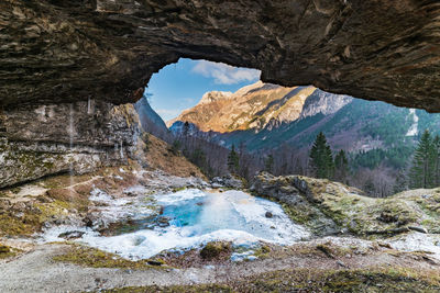 Winter. ice games in the fontanon of goriuda waterfall. friuli, italy.