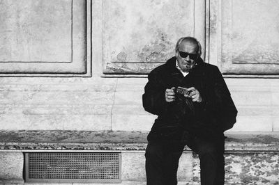 Man standing on wall