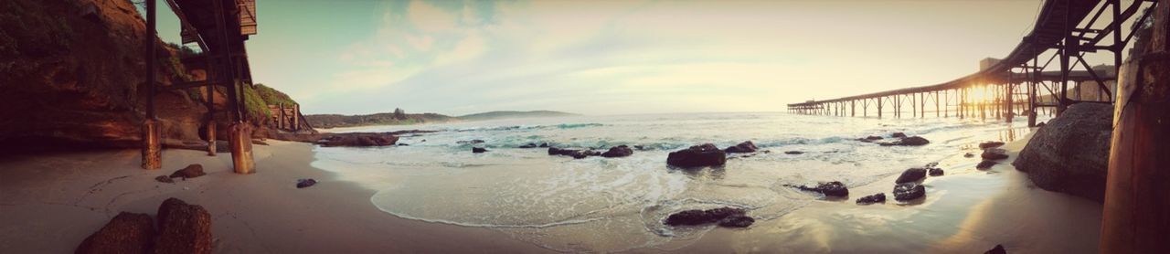 sea, beach, water, horizon over water, shore, sand, sky, scenics, vacations, panoramic, beauty in nature, nature, built structure, tranquil scene, incidental people, tranquility, architecture, sunlight, wave, large group of people