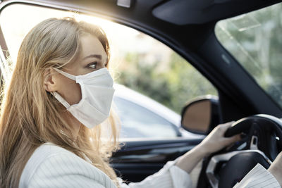 Portrait of woman in car