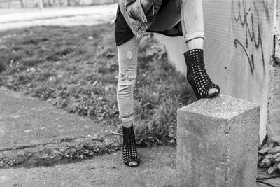 Low section of man standing on ground