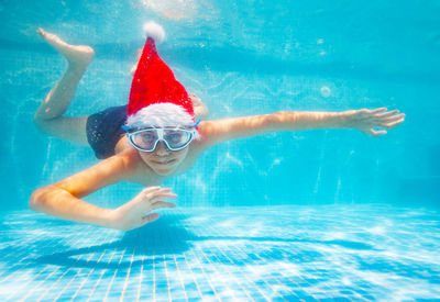 Man swimming in pool