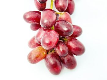 Close-up of grapes against white background