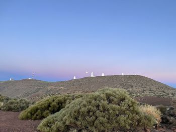 Scenic view of landscape against clear blue sky