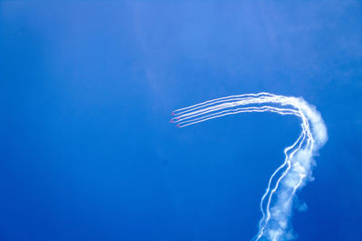 Close-up of smoke against blue background