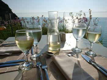 Close-up of wine glasses on table