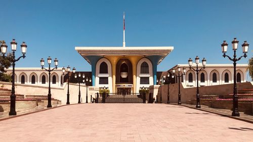 View of historical sultan building against clear sky oman muscat 