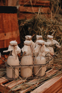 Milk bottle mockups lying on the hay. autumn farm fair market. rustic style. thanksgiving