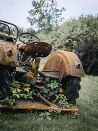 Abandoned vintage car on field