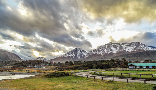 Scenic view of mountains against cloudy sky