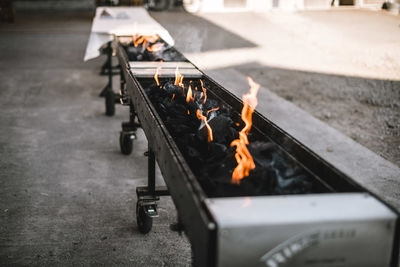 High angle view of fire on barbecue grill