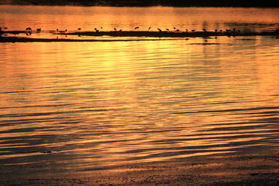 Scenic view of sea at sunset