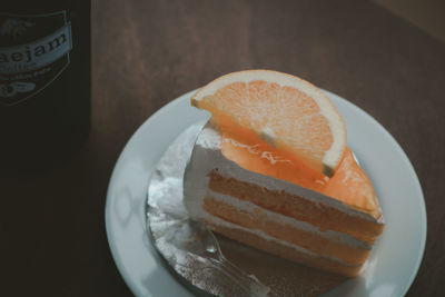 High angle view of orange slice in plate on table