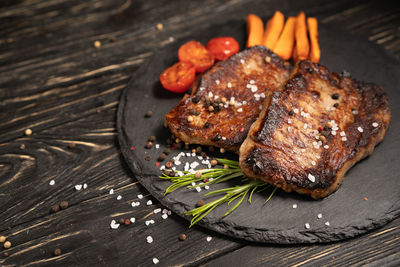 High angle view of meat on barbecue grill