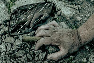 Close-up of man hand holding car