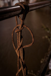 Close-up of rope tied on metal