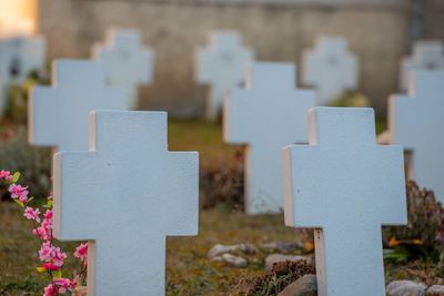 Close-up of cross on cemetery