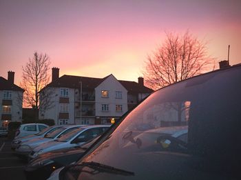 Cars on road at sunset