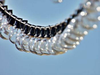 Close-up of metallic object against blue background