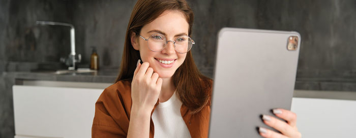 Young woman using mobile phone