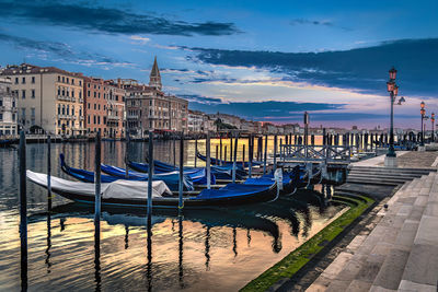 Boats moored at harbor
