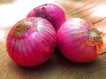 Close-up of apple on wooden table