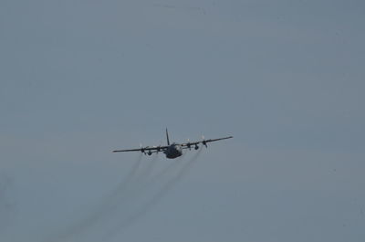 Low angle view of airplane against clear sky