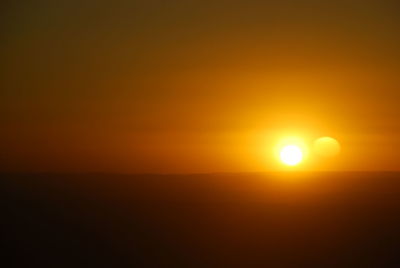 Scenic view of landscape against sky during sunset