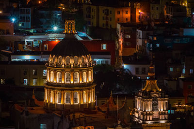 Illuminated buildings in city at night
