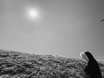 Low angle view of people against sky