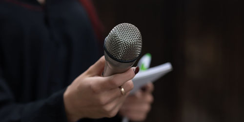 Close-up of man hand holding mobile phone