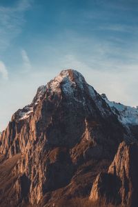 Rock formation against sky during winter