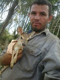 Portrait of man with dog