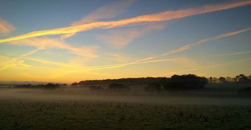 Scenic view of landscape against sky during sunset