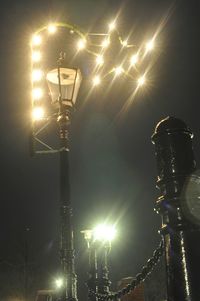 Low angle view of illuminated street light