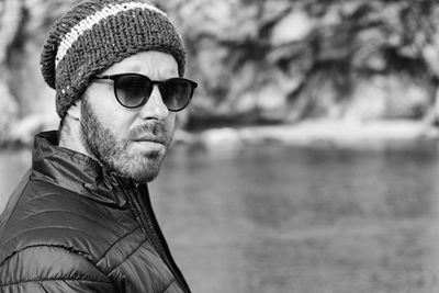 Portrait of young man wearing sunglasses outdoors