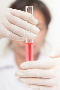 Close-up of pipette with pink liquid