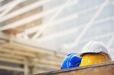 Yellow umbrella against construction site