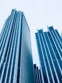 Low angle view of modern buildings against clear sky