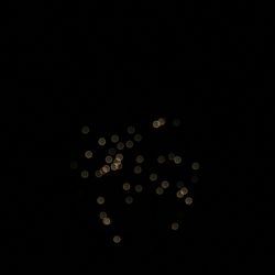 Close-up of illuminated lamp over black background