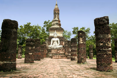 View of old temple against building