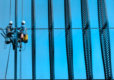 Low angle view of cables against clear sky