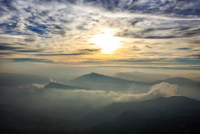 Scenic view of mountains against sky during sunset