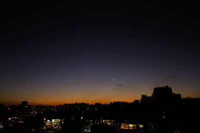 Illuminated cityscape at night