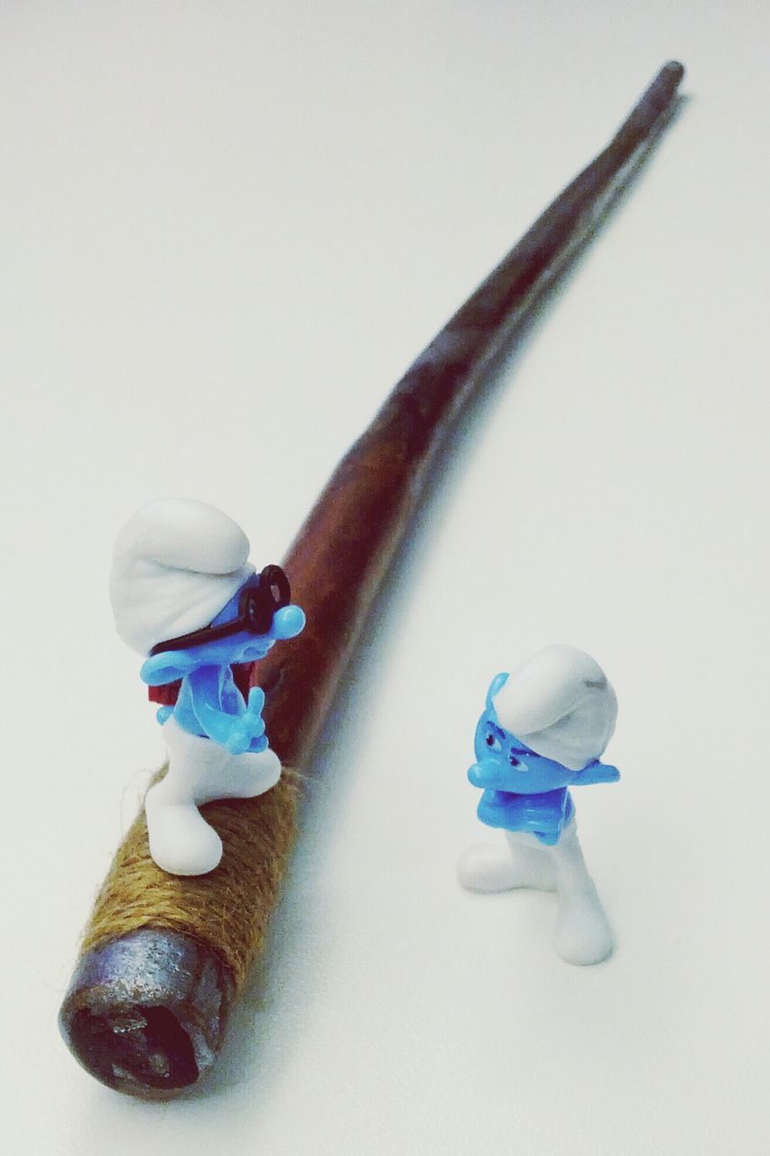 still life, studio shot, indoors, blue, white background, close-up, toy, two objects, variation, copy space, high angle view, single object, no people, table, man made object, multi colored, plastic, childhood, three objects, art and craft