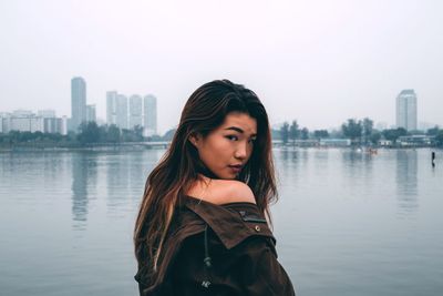 Portrait of young woman in water